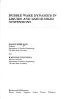 Bubble wake dynamics in liquids and liquid-solid suspensions